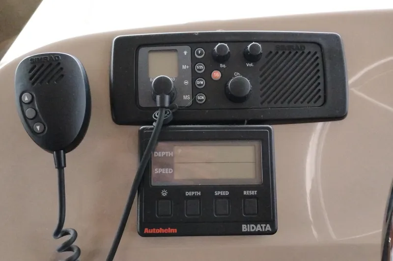 Slide: The Image of Control panel of 1995 Bayliner 3988 Motoryacht with Simrad radio and Autopilot display. - 30