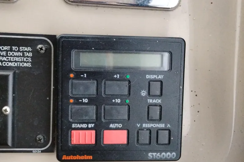 Slide: The Image of Autopilot control panel on 1995 Bayliner 3988 Motoryacht, featuring Autohelm ST6000 system. - 32