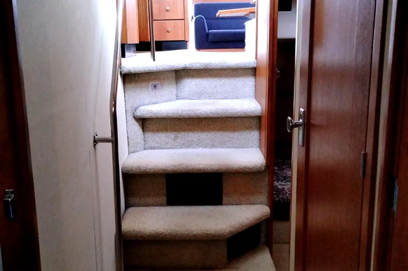 Slide: The Image of Interior stairs of 1995 Bayliner 3988 Motoryacht, leading to upper cabin area. - 35