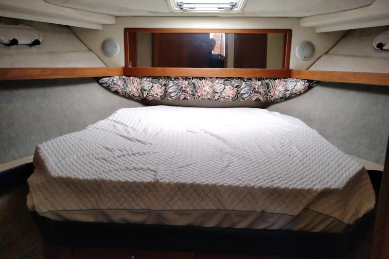 Slide: The Image of 1995 Bayliner 3988 Motoryacht bedroom with floral decor and cozy bedding. - 36
