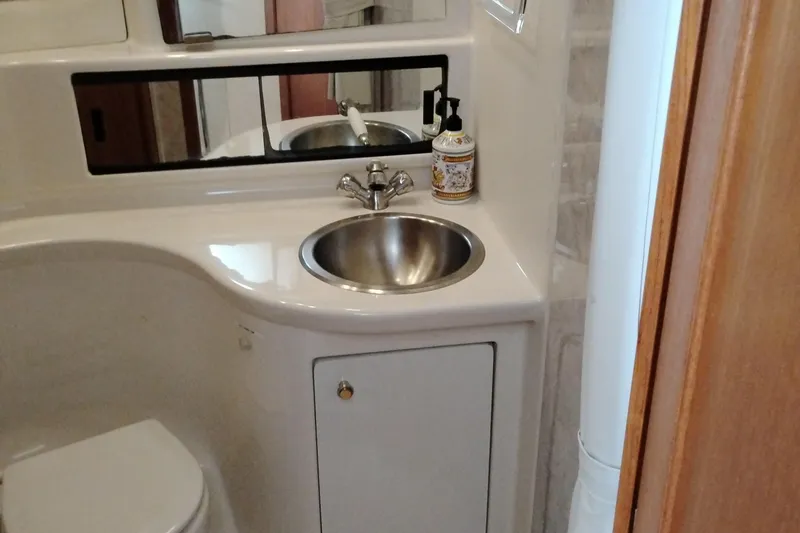 Slide: The Image of Bathroom interior of 1995 Bayliner 3988 Motoryacht with sink and mirror. - 40