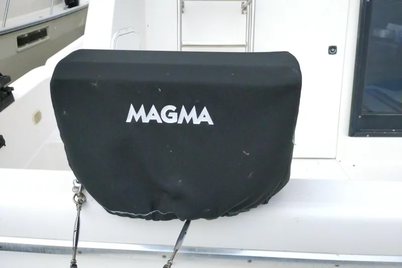 Slide: The Image of Black Magma grill cover on 1995 Bayliner 3988 Motoryacht deck. - 6