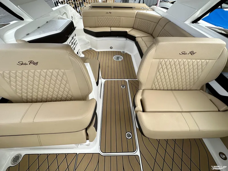 Slide: The Image of Luxurious interior of 2024 Sea Ray 310 SLX boat with beige leather seating. - 11