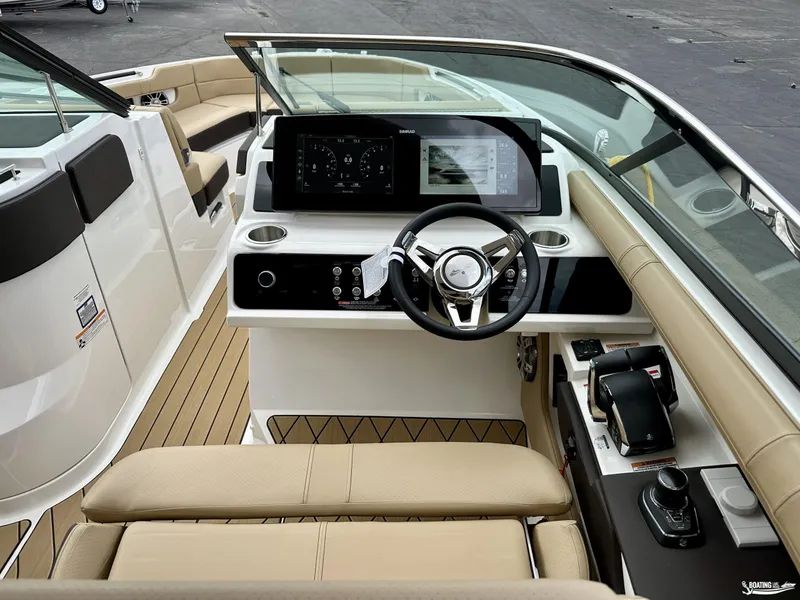 Slide: The Image of 2024 Sea Ray 310 SLX boat interior with modern dashboard and steering wheel. - 4