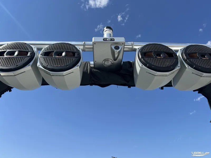 Slide: The Image of 2023 MasterCraft XT24 boat speakers against clear blue sky. - 10