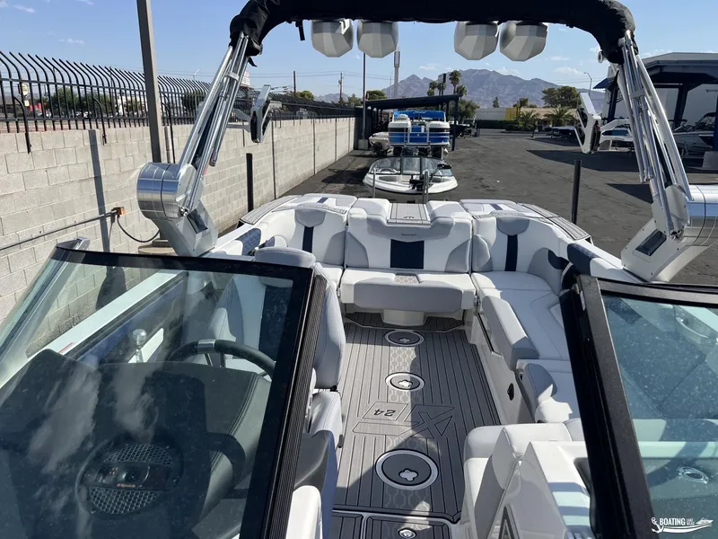 Slide: The Image of 2023 MasterCraft XT24 boat interior with luxury seating and advanced features. - 5