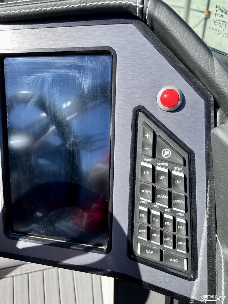 Slide: The Image of Control panel of 2023 MasterCraft XT24 boat with touchscreen and buttons. - 6