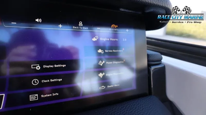 Slide: The Image of 2024 Nautique GS22 dashboard display showing engine hours and settings. - 14