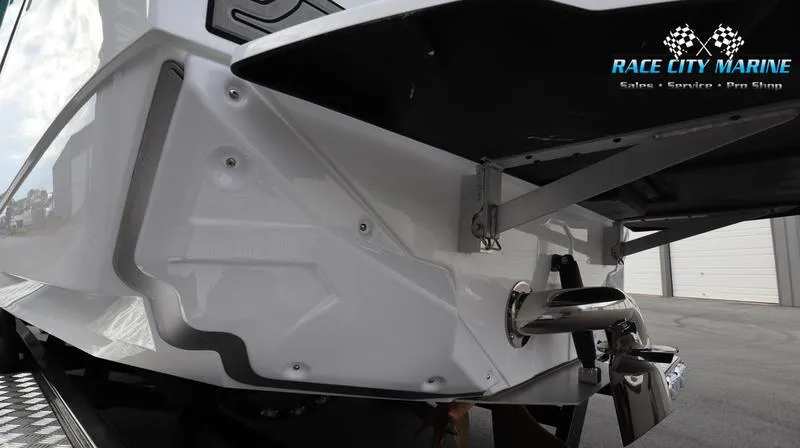 Slide: The Image of 2024 Nautique GS22 boat rear view at Race City Marine. - 16
