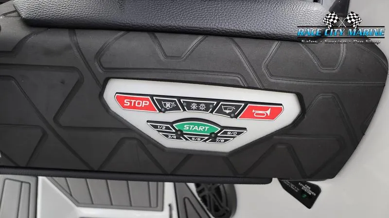 Slide: The Image of Control panel of 2024 Nautique GS22 boat with start and stop buttons. - 22