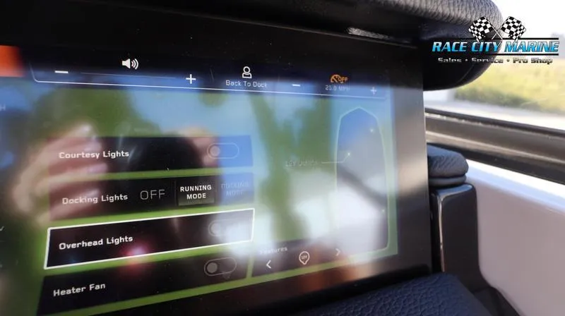 Slide: The Image of 2024 Nautique GS22 touchscreen control panel displaying lighting and fan options. - 23