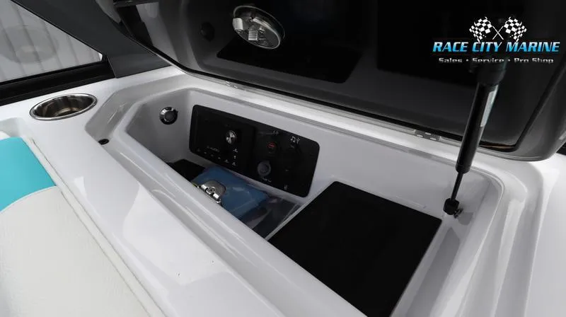 Slide: The Image of 2024 Nautique GS22 boat storage compartment with control panel at Race City Marine. - 26