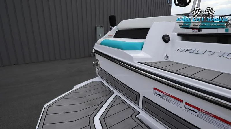 Slide: The Image of 2024 Nautique GS22 boat rear deck and seating area at Race City Marine. - 29
