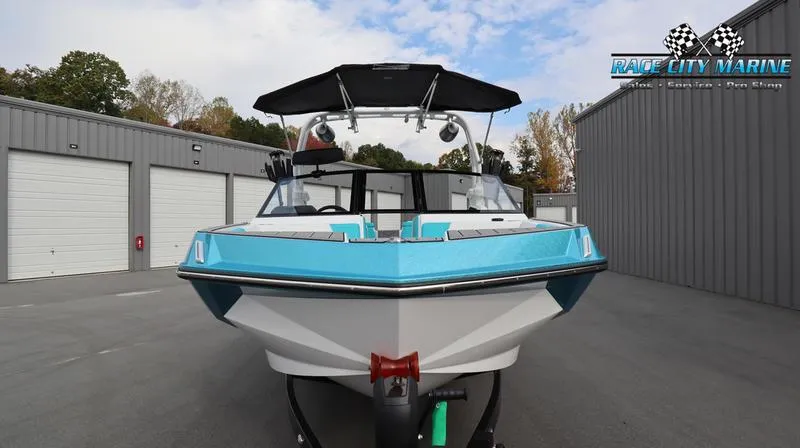Slide: The Image of 2024 Nautique GS22 boat in a storage facility, front view. - 3