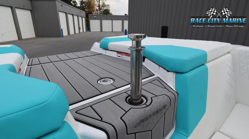 Slide: The Image of 2024 Nautique GS22 boat interior at Race City Marine dealership. - 36