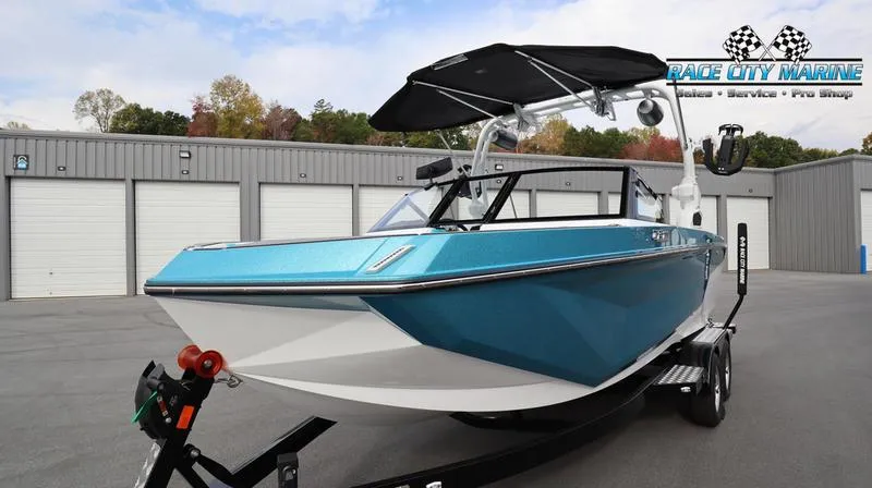 Slide: The Image of 2024 Nautique GS22 boat on trailer at Race City Marine dealership. - 4