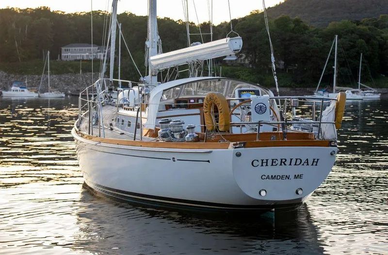 Slide: The Image of Hinckley OceanCruising 52 sailboat, 1997 model, named Cheridah, docked in calm waters. - 15
