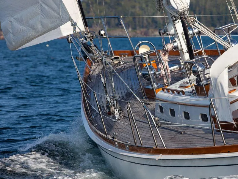 Slide: The Image of Hinckley OceanCruising 52 sailboat from 1997 navigating through blue waters. - 26