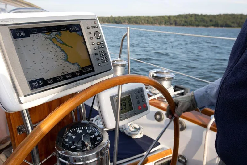 Slide: The Image of Helm of 1997 Hinckley OceanCruising 52 with navigation equipment on open water. - 33