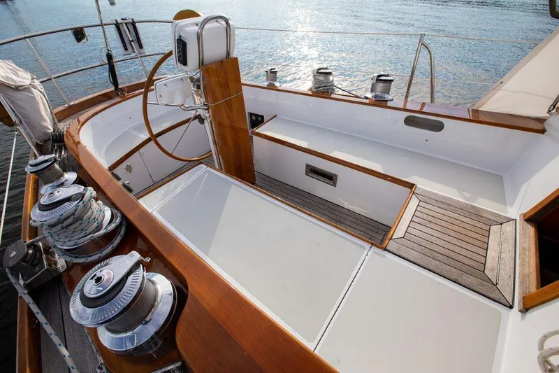 Slide: The Image of Hinckley OceanCruising 52 yacht cockpit, 1997 model, featuring wooden accents and steering wheel. - 34