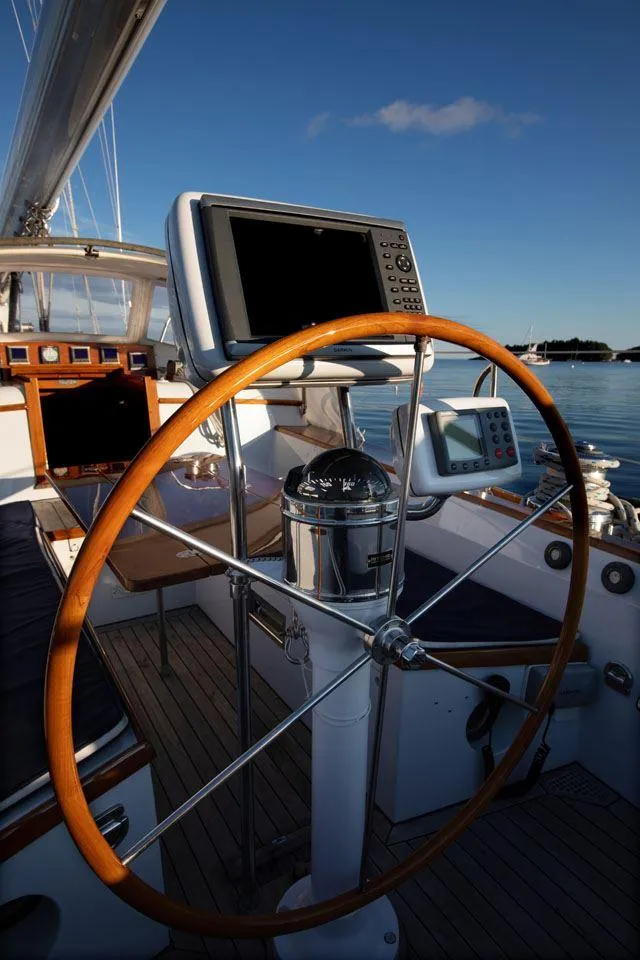 Slide: The Image of Hinckley OceanCruising 52 yacht helm with navigation equipment, 1997 model, on calm waters. - 37