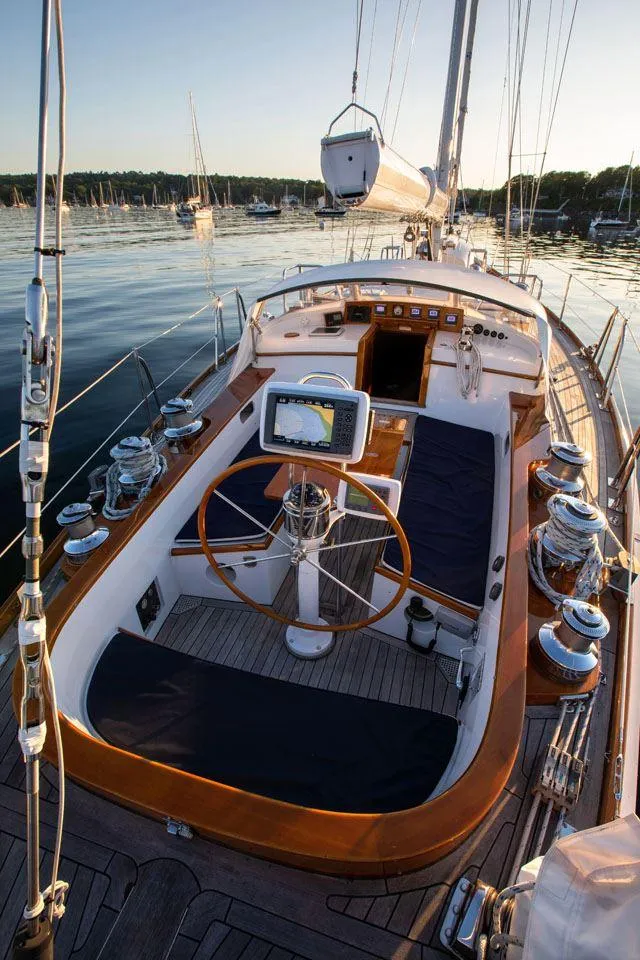 Slide: The Image of Hinckley OceanCruising 52 yacht, 1997 model, elegant deck with wooden accents and steering wheel. - 38