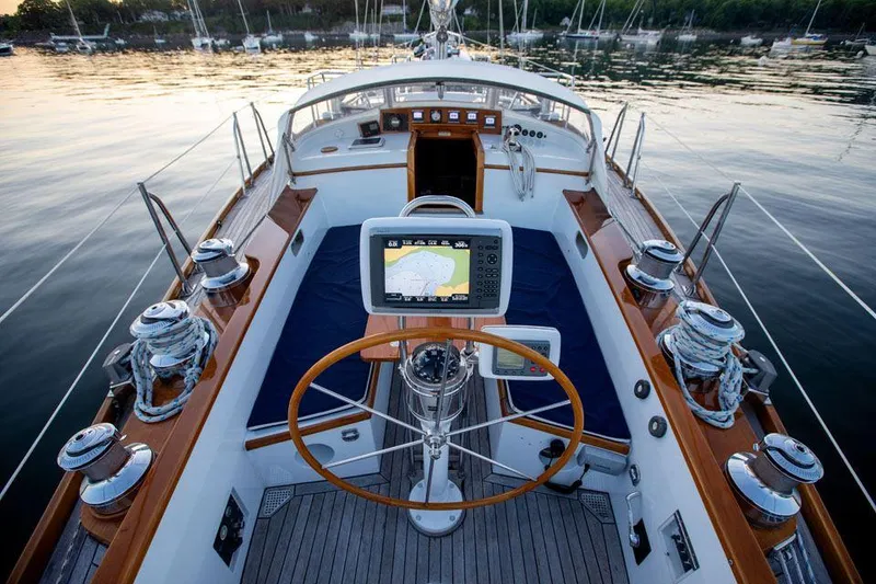 Slide: The Image of Cockpit of 1997 Hinckley OceanCruising 52 yacht with navigation equipment and wooden accents. - 40