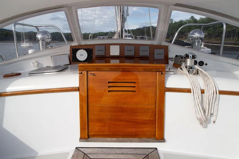 Slide: The Image of Hinckley OceanCruising 52 cockpit, 1997 model, featuring wooden paneling and nautical equipment. - 41