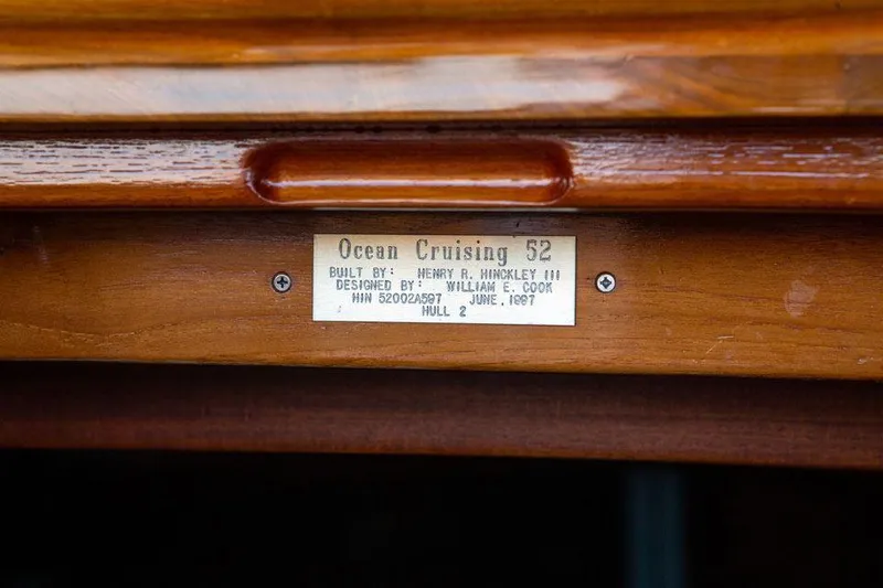 Slide: The Image of Plaque on Hinckley OceanCruising 52 yacht, built 1997, displaying model and designer details. - 45