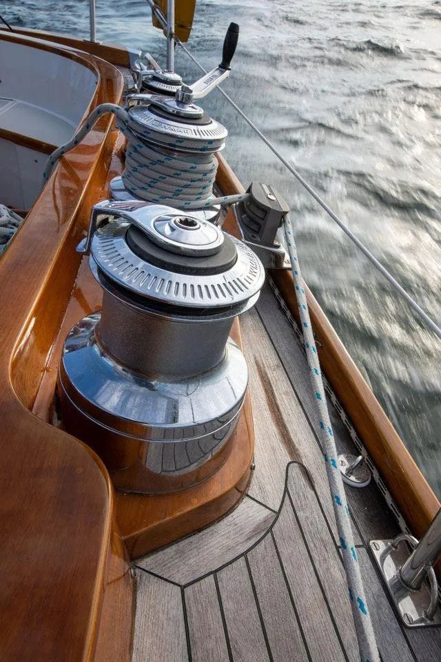 Slide: The Image of Hinckley OceanCruising 52 sailboat deck with winches, 1997 model, on open water. - 46