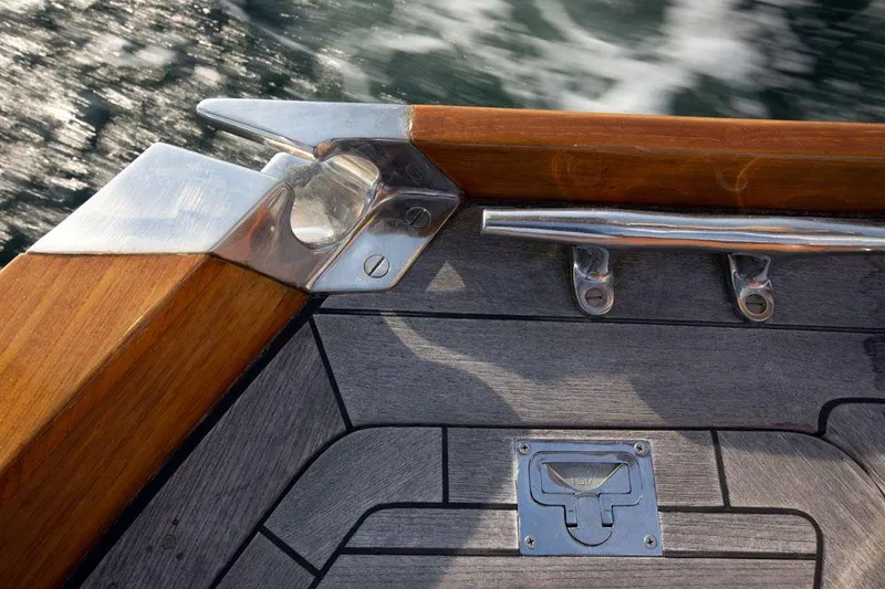 Slide: The Image of Hinckley OceanCruising 52 deck detail, featuring wood and metal elements, 1997 model. - 48