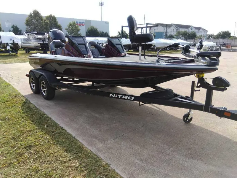 Slide: The Image of 2024 Nitro Z18 bass boat on trailer in outdoor dealership lot. - 3