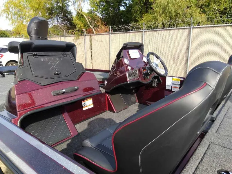 Slide: The Image of 2024 Nitro Z18 boat interior with steering console and seating. - 7