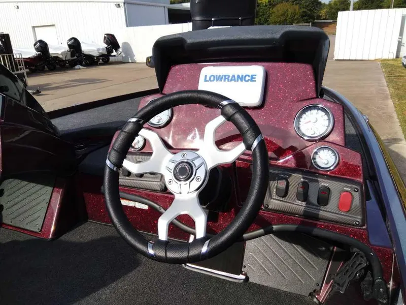 Slide: The Image of 2024 Nitro Z18 boat dashboard with Lowrance electronics and steering wheel. - 8