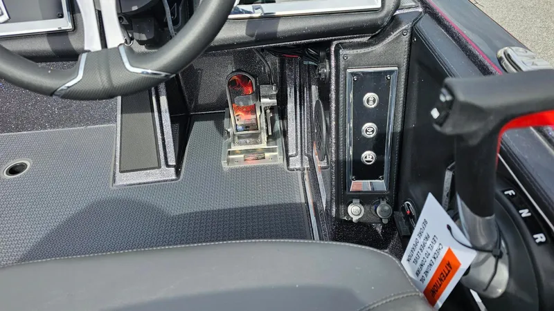 Slide: The Image of 2024 Ranger Z521R Ranger Cup Equipped boat cockpit controls and steering wheel. - 16