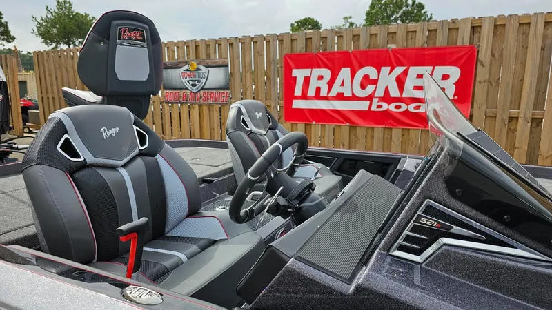 Slide: The Image of 2024 Ranger Z521R Ranger Cup Equipped boat interior with Tracker Boats banner. - 18