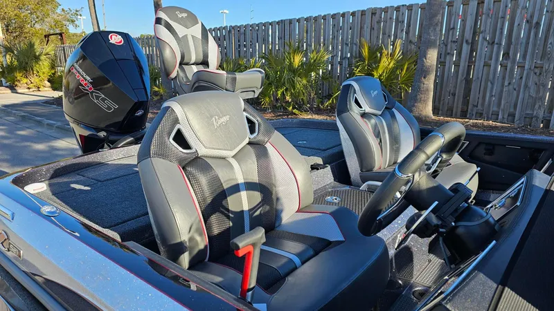 Slide: The Image of 2024 Ranger Z521R Ranger Cup boat interior with sleek seats and steering wheel. - 2