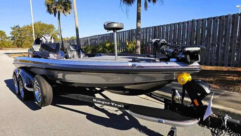 Slide: The Image of 2024 Ranger Z521R Ranger Cup Equipped boat on trailer, parked outdoors. - 5