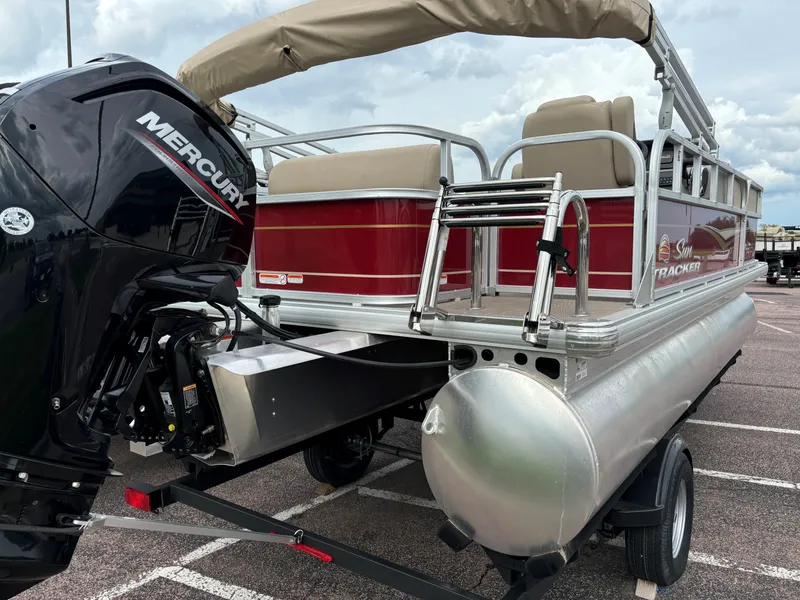 Slide: The Image of 2024 Sun Tracker Party Barge 18 DLX pontoon boat with Mercury outboard motor. - 3