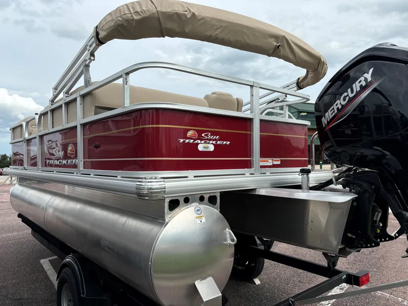 Slide: The Image of 2024 Sun Tracker Party Barge 18 DLX pontoon boat with Mercury outboard motor. - 4