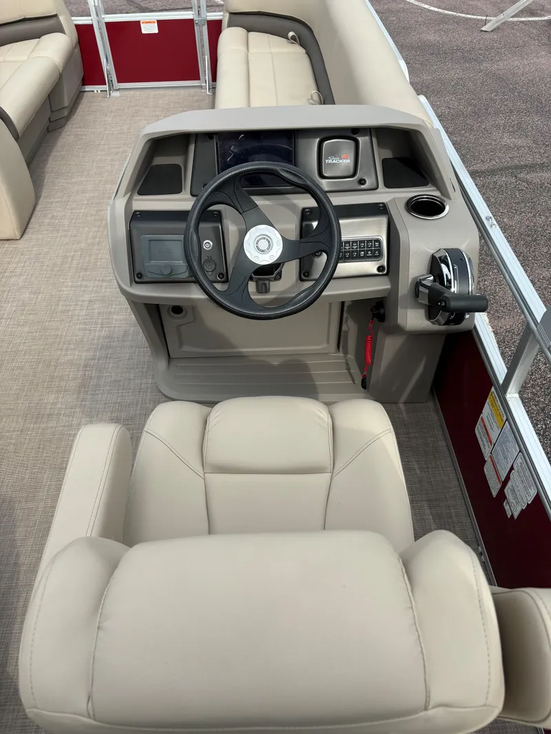 Slide: The Image of 2024 Sun Tracker Party Barge 18 DLX helm and seating area. - 7