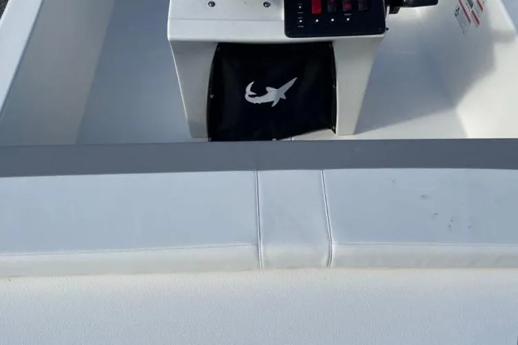 Slide: The Image of 2024 Mako Pro Skiff 13 CC center console with shark logo. - 3