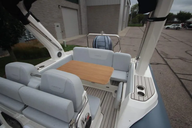 Slide: The Image of 2024 Zodiac Medline 7.5 NEO boat interior with seating and table. - 10
