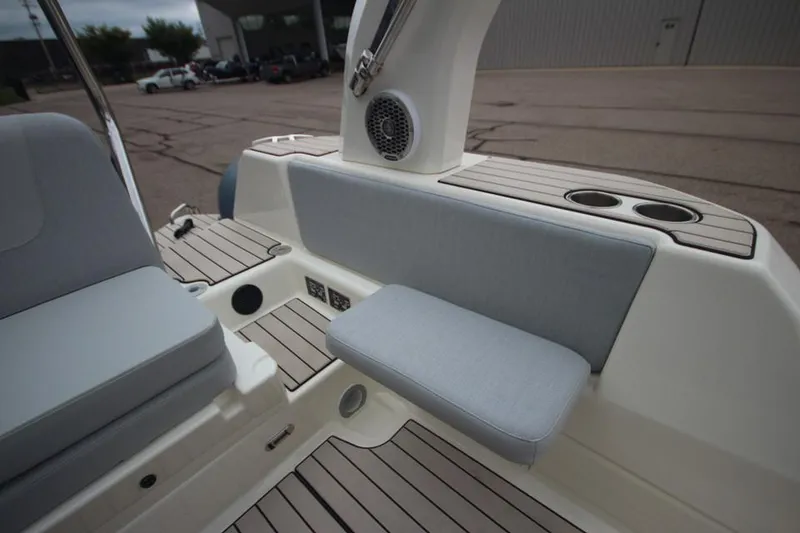 Slide: The Image of 2024 Zodiac Medline 7.5 NEO boat interior with cushioned seating and cup holders. - 13