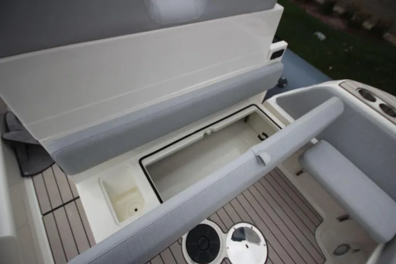 Slide: The Image of 2024 Zodiac Medline 7.5 NEO boat interior storage compartment and seating area. - 16