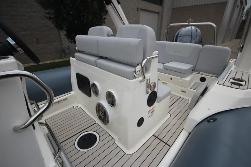Slide: The Image of 2024 Zodiac Medline 7.5 NEO boat interior with seating and speakers. - 19