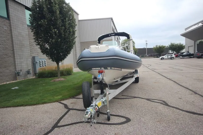 Slide: The Image of 2024 Zodiac Medline 7.5 NEO boat on trailer in parking lot. - 2