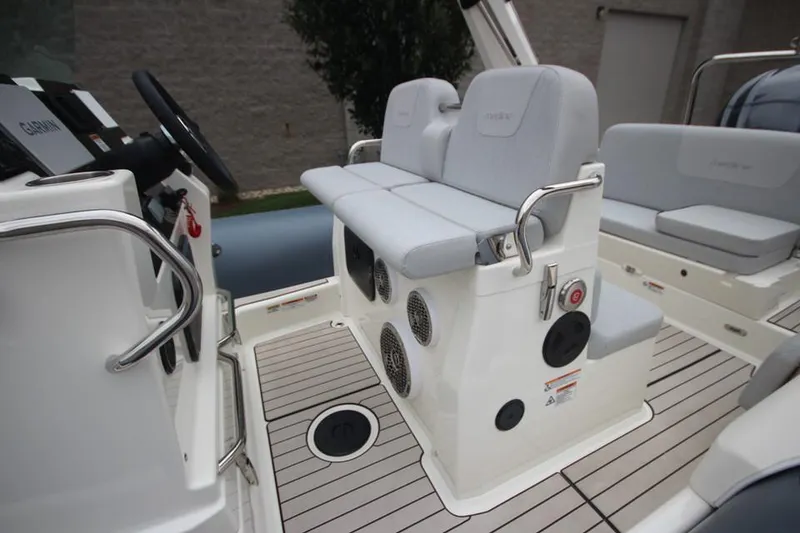 Slide: The Image of 2024 Zodiac Medline 7.5 NEO boat interior with seating and controls. - 20