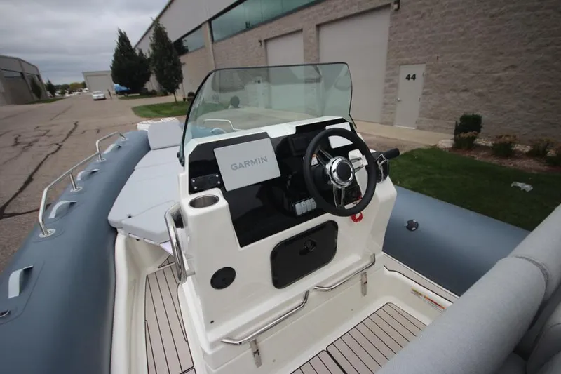 Slide: The Image of 2024 Zodiac Medline 7.5 NEO boat with Garmin navigation, docked outdoors. - 21