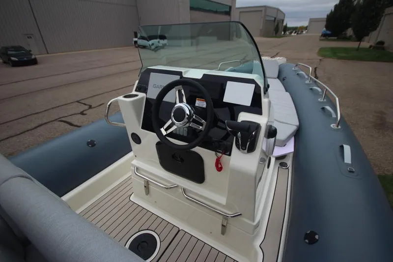 Slide: The Image of 2024 Zodiac Medline 7.5 NEO boat with 300hp, featuring sleek console and steering wheel. - 22